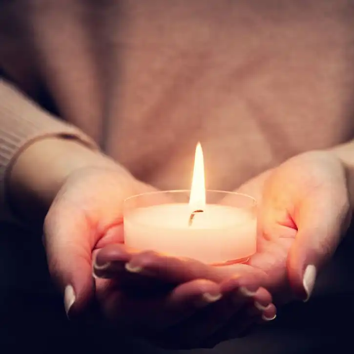 Candlelight symbolizing prayer and peace