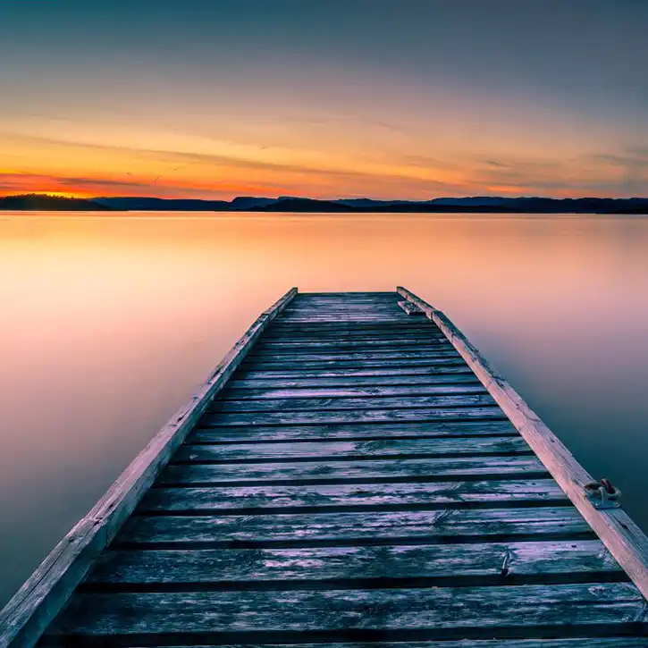 peaceful setting at lake with pier